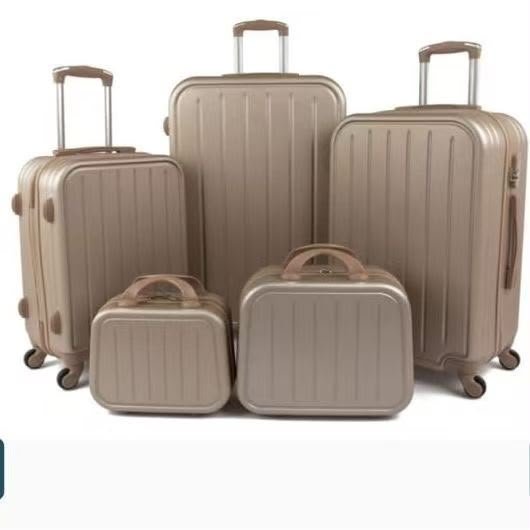 Champagne-colored luggage set with vertical lines
